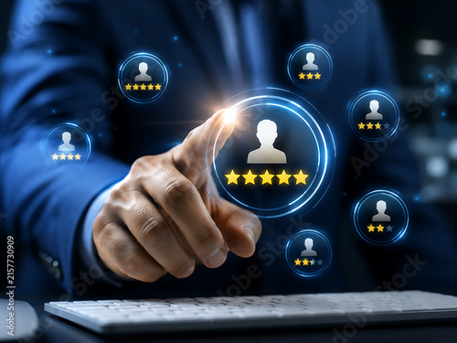 Customer feedback and ratings concept with hand touching star icons and user profiles