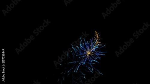 Close-up slow motion spark or ember glowing and fading in complete darkness for dramatic effect