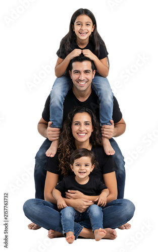 Family of four posed in a pyramid formation parents holding children t shirts white background family life children
