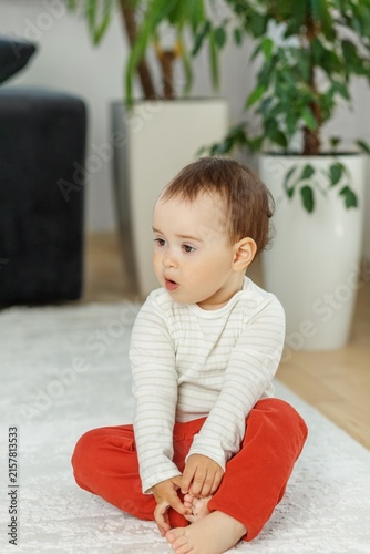 Toddler with Surprised Expression Looking to Side at Home