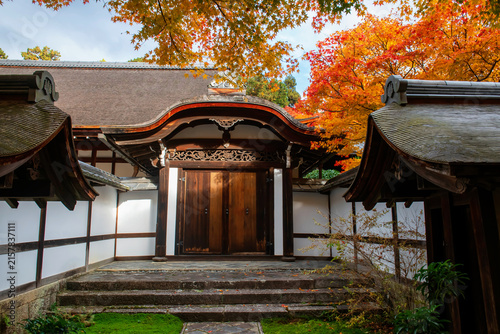 Ryoan-ji temple gate with autumn maple leaf garden, Kyoto