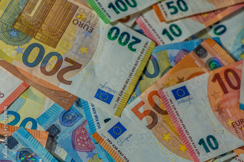 Colorful assortment of euro banknotes arranged creatively on a flat surface