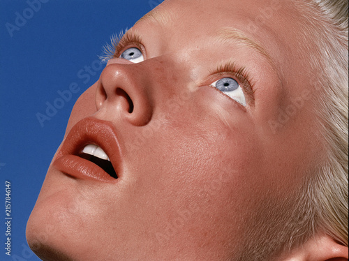 extreme close-up of a young blonde woman’s face
