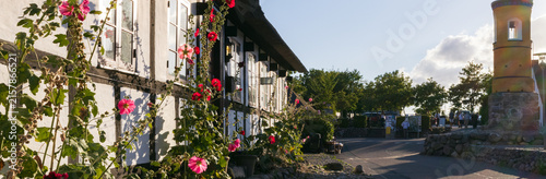Picturesque summer panorama of the historic timber framed village of Nordby on Samso, with famous yellow bell tower, a top travel destination in Denmark