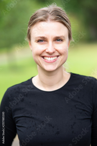 Portrait of beautiful smiling blonde young woman 