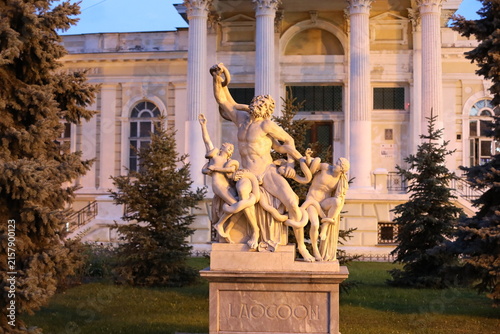 statue of laocoon and his sons. sculpture in pastel colors. beautiful view of white color monument in the evening lights