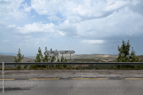 Bild auf Leinwand Road signs pointing direction to Triacastela and Pedrafita