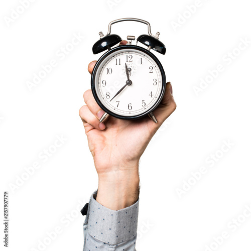 Obraz na płótnie man holding alarm clock