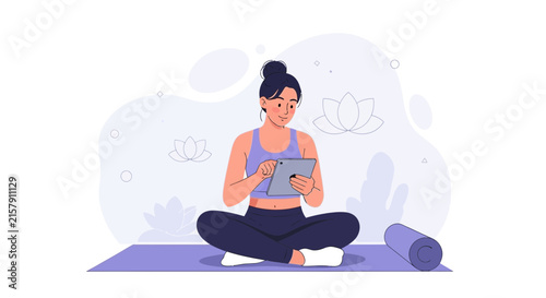 Woman Meditating with Tablet on Yoga Mat, Online Yoga Class, Wellness and Digital Technology Concept