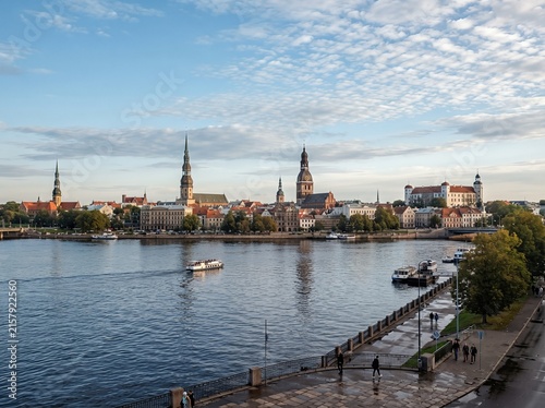 A panoramic view of Riga's old town across the river, leaving space in the sky for copy