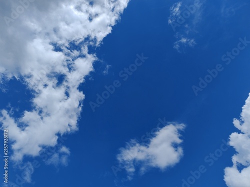 Blue Sky with Fluffy White Cumulus Clouds Creating a Beautiful Cloudscape on a Sunny Summer Day, Peaceful Nature and Atmospheric Weather Background