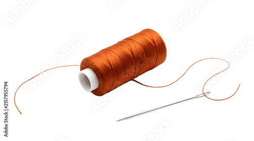 Spool of orange thread with a sewing needle isolated on transparent background