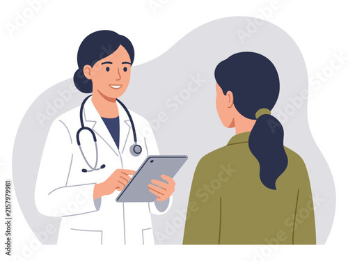 Female doctor talking to a patient while holding a tablet in a modern medical clinic