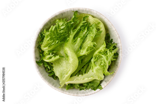 Top view ceramic bowl filled with fresh green lettuce leaves, crisp ruffled texture, bright natural light, clean white background, simple healthy food composition for menu, wellness and fresh