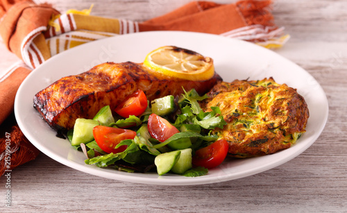 Healthy diet plate with salad, zucchini fritters