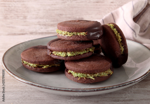 Chocolate sandwich cookies with pistachio filling