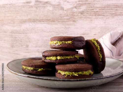 Chocolate sandwich cookies with pistachio filling