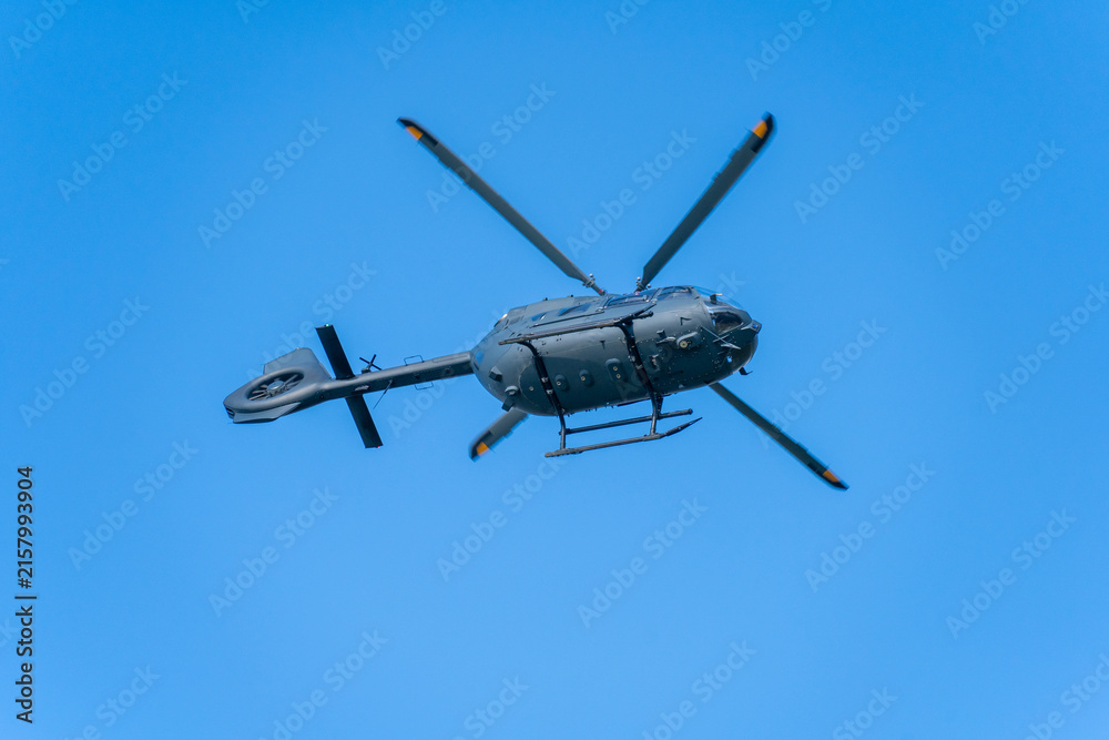 Fototapeta premium Black modern military transport helicopter flying over Budapest, Hungary