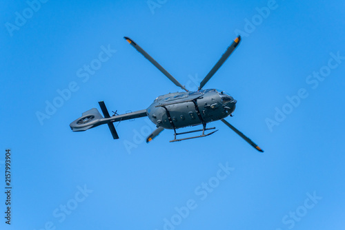 Black modern military transport helicopter flying over Budapest, Hungary