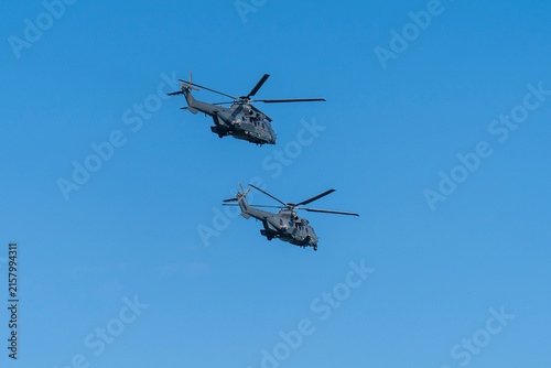 Black modern military transport helicopter flying over Budapest, Hungary