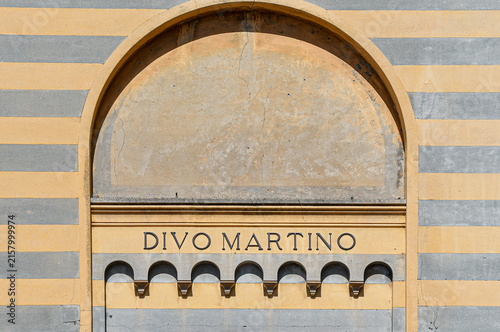Bild auf Leinwand Architectural detail of Divo Martino church facade with yellow and grey stripes
