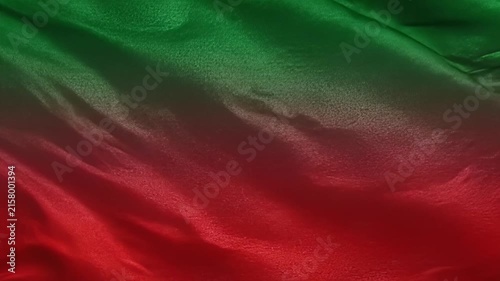 Waving Red and Green Fabric Background Texture with Smooth Silk Waves and Subtle Light Reflections