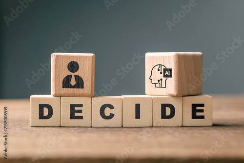 Fotografie Human and AI symbols on DECIDE blocks represent questions about who should decid