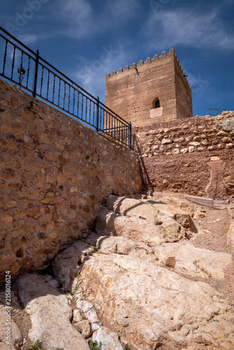 Medieval Tower of Homage of Aledo Castle, Region of Murcia, Spain, on a sunny day