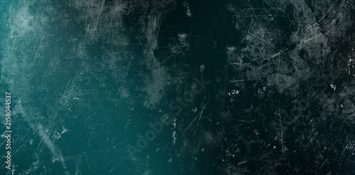 Obraz na płótnie Dark teal grunge background with heavy white scratches and distressed vignette effect suitable for moody digital artwork horror movie posters and atmospheric social media banners