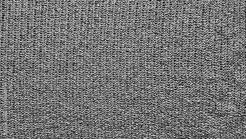 grey knit fabric texture macro closeup seamless wool pattern background for web design advertising branding