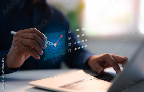 Strategic planning for business target concept, A Businessman select target goals strategic for business purpose, goal achievement and futuristic innovation for strategic planning.