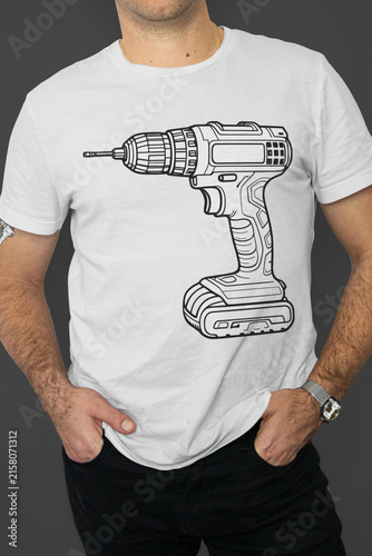 A man wearing a T-shirt with a drill on it