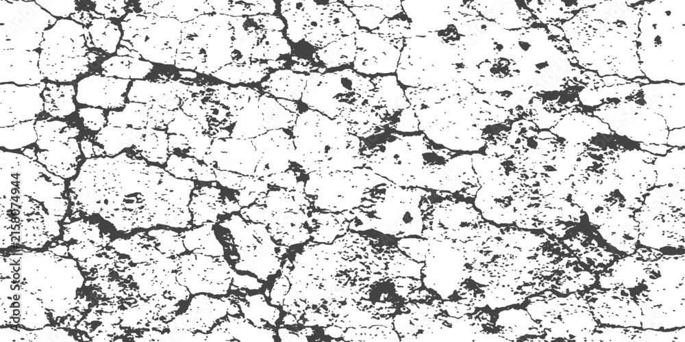 Fototapeta premium Cracked dry earth texture with deep fissures and rough surface under stark lighting creating a distressed abstract backdrop
