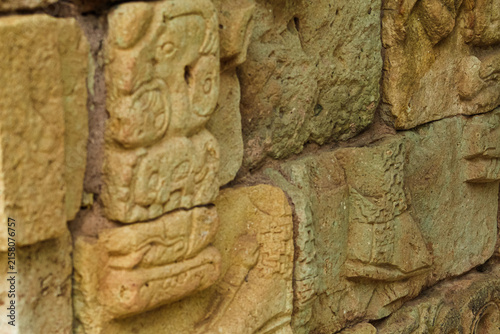 Fotografie Details of Mayan glyphs on a stone panel
