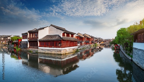 traditional chinese architecture along a serene canal