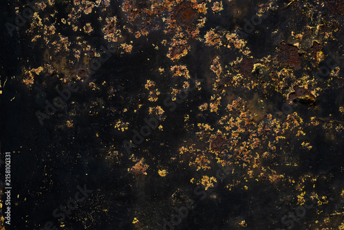 Fotografía Black rusted metal texture background with orange corrosion and distressed surfa