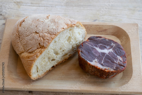 rustic bread cured meat capocollo wooden board