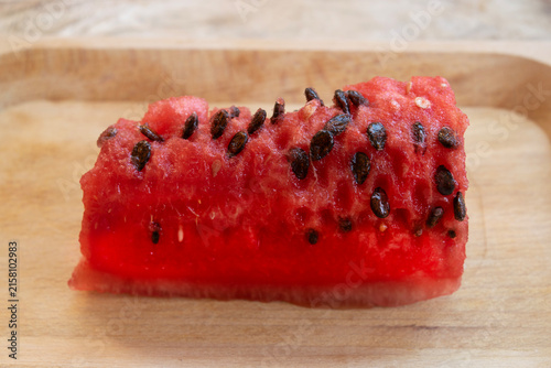 Fresh watermelon slice on wooden tray