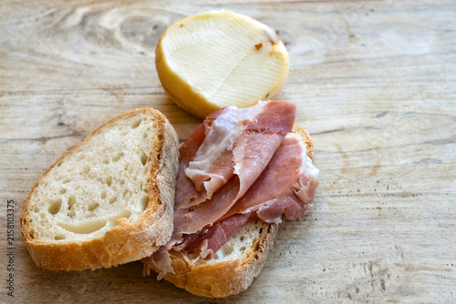 prosciutto bread cheese wooden surface