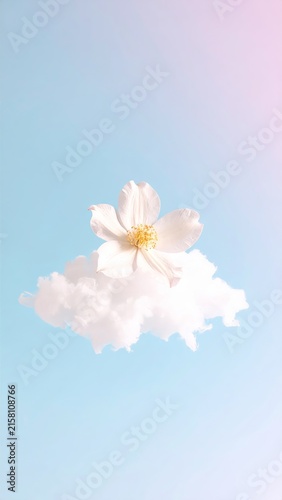a white flower is floating in the air