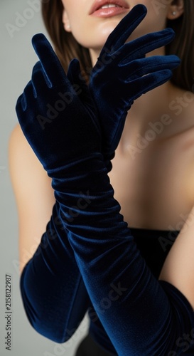 woman wearing long black velvet gloves for a formal fashion look