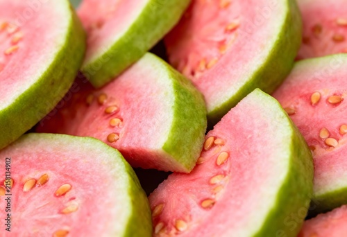 Fresh pink guava fruit slices macro view with vitamin c tropical vitamins vegetarian superfood