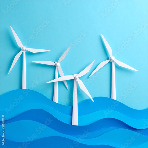 three wind turbines floating in the ocean
