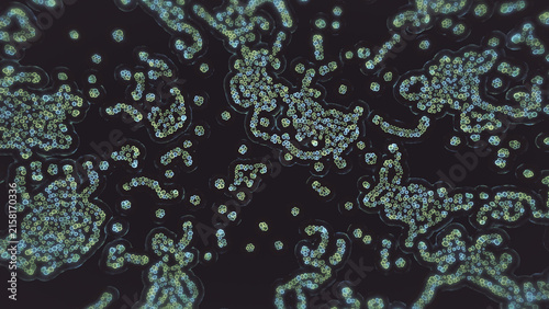 Glowing green and blue circular patterns forming organic network shapes