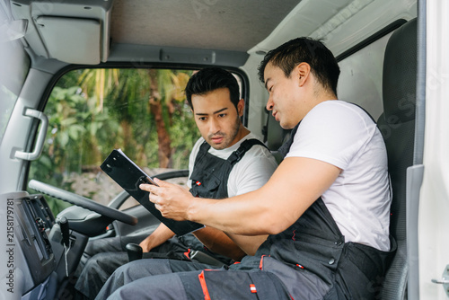 Delivery Professionals Reviewing Logistics Plan for Efficient Transportation Service