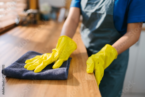 Home Cleaner Wiping Kitchen Countertop Residential Maintenance Service