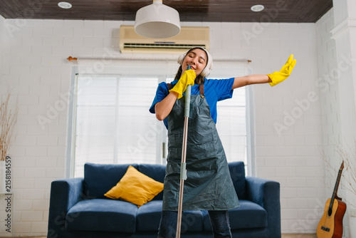 Woman Cleaning Home Happily with Music