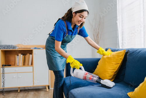 Professional Cleaner Vacuuming Sofa Modern Living Room Home Hygiene Service