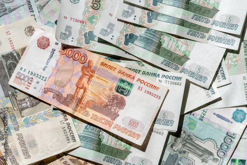 Paper banknotes of Russian rubles of different denominations in a stack close-up