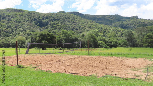 green field and mountains